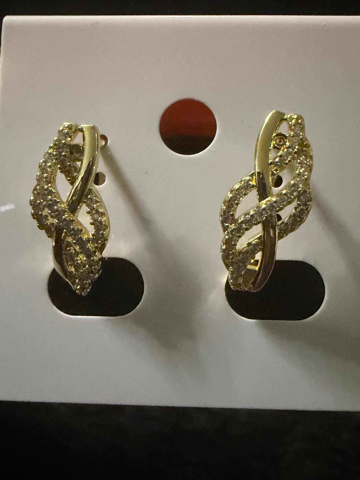 Twisted Huggies gold-tone hoop earrings with a sparkling pave crystal twisted design for elegant daily wear