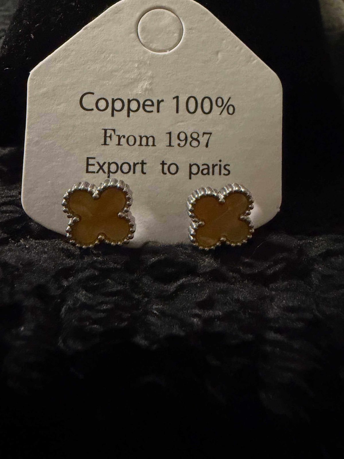 Clover Earrings made of copper with a polished finish and silver beaded edge detailing in a four-leaf clover shape.